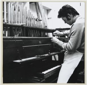 Fitting organ pipes. Image associated with photographic illustrations used in 