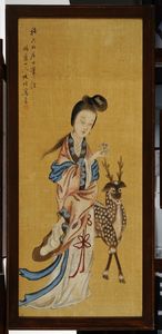 Si Wang Mu, Mother of the West standing holding a branch of Longchih fungus, symbolic of longevity, at her side a standing stag