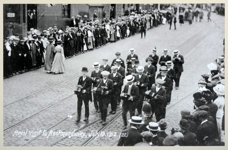 The Heckmondwike English Concertina Band playing on the occasion of a royal visit to Heckmondwike on 10 July 1912. Image used for one of the photographic illustrations in 