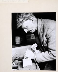 Mr Jim Peacock, stonemason of Castle Bolton, using a small lettering chisel and a mash hammer to carve his trademark. Image used for one of the photographic illustrations in 