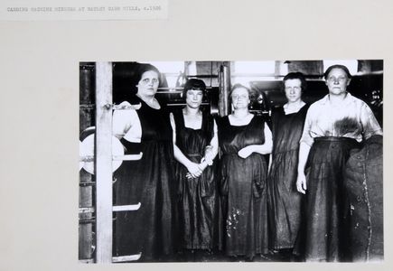 Carding machine minders or feeders wearing black Italian pinafores, at Joshua Ellis and Co., Batley Carr Mills (c.1926). Image used for one of the photographic illustrations in 